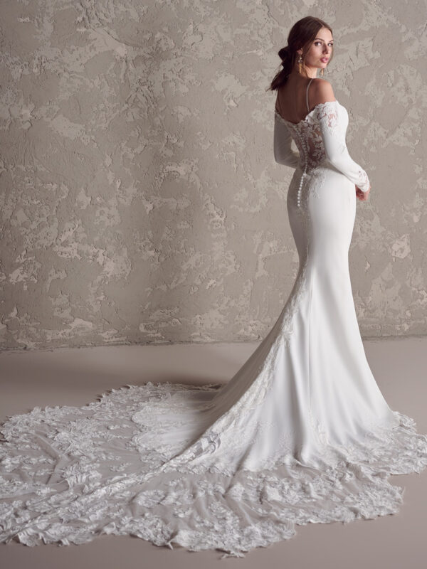 A little embellishment goes a long way in a minimalist style. Cue this long sleeve crepe bridal gown for that perfect balance of glamour, elegance, and flourish.
