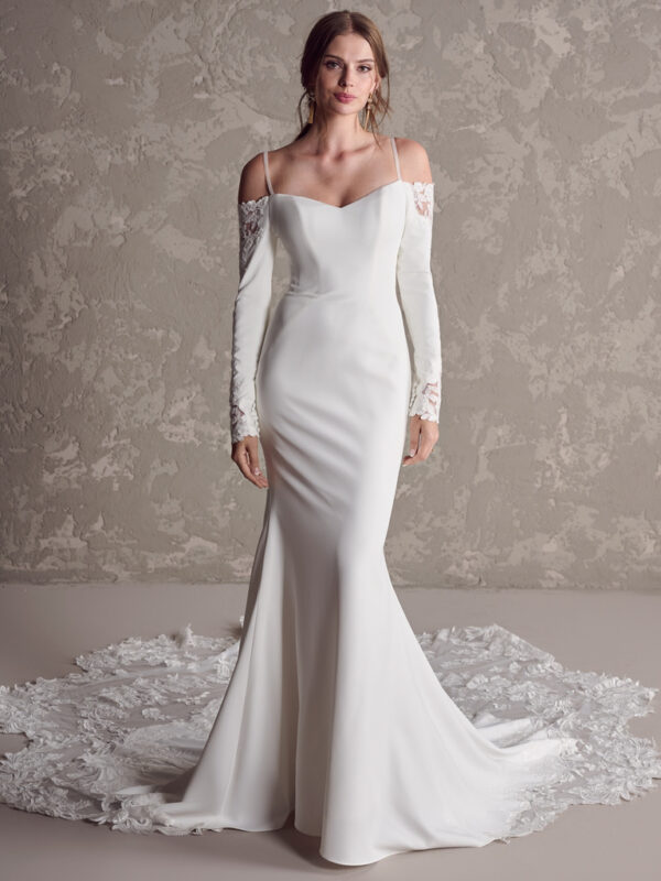 A little embellishment goes a long way in a minimalist style. Cue this long sleeve crepe bridal gown for that perfect balance of glamour, elegance, and flourish.