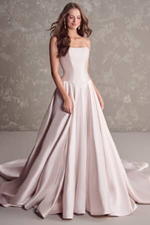 Regal drama with a twist: This yarn-dyed strapless wedding dress with an unexpectedly chic basque waistline and irresistible satin fabric