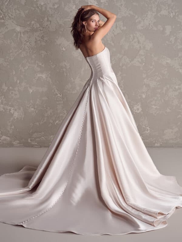 Regal drama with a twist: This yarn-dyed strapless wedding dress with an unexpectedly chic basque waistline and irresistible satin fabric