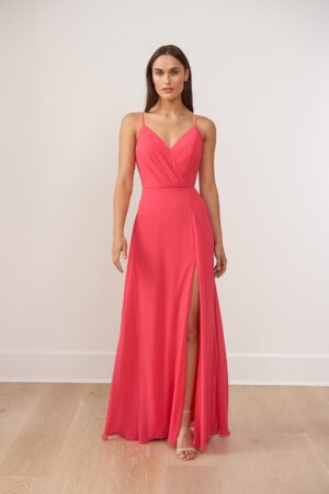 A beautiful Poly Chiffon A-line gown with sweetheart neckline and soft gathers radiating asymmetrically. The back has a fabric sash that ties into a lovely bow with streamers while the adjustable spaghetti straps meet at the slight v-neckline back. The skirt will feel effortless and magical when you walk with its front slit. Special Detail: Pockets