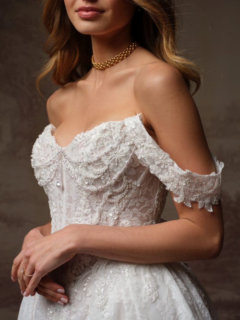 Ryland by Maggie Sottero, regal lace ball gown wedding dress shown with sleeves